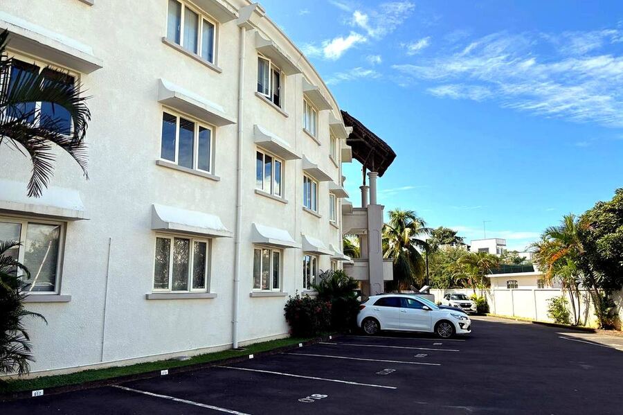 Rear view of Grand Baie Business Park building with parking