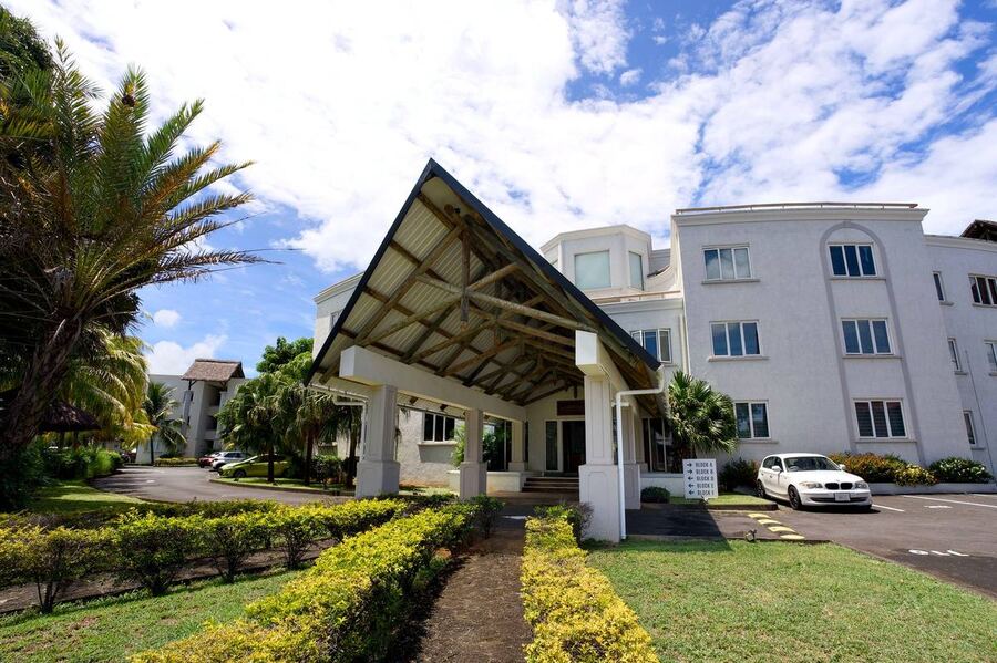Grand Baie Business Park entrance walkway with palm trees